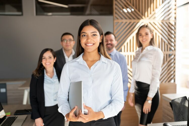 Confident hispanic business woman in office